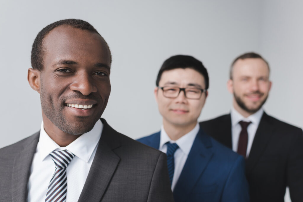 Three leadership and management trainers posing for a photo